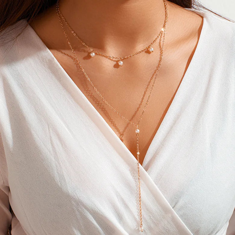 Dangling pearls gold necklace